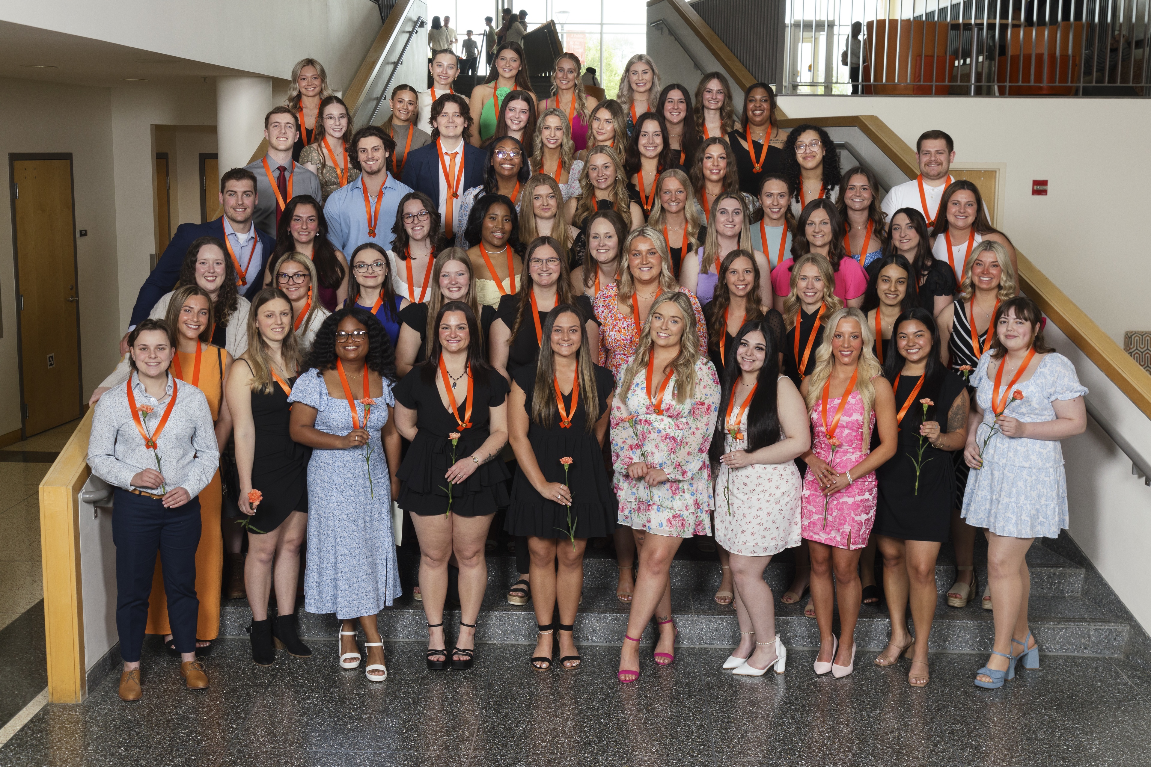  A group of BGSU nursing students stand on the stairs in the Bowen-Thompson Student Union.