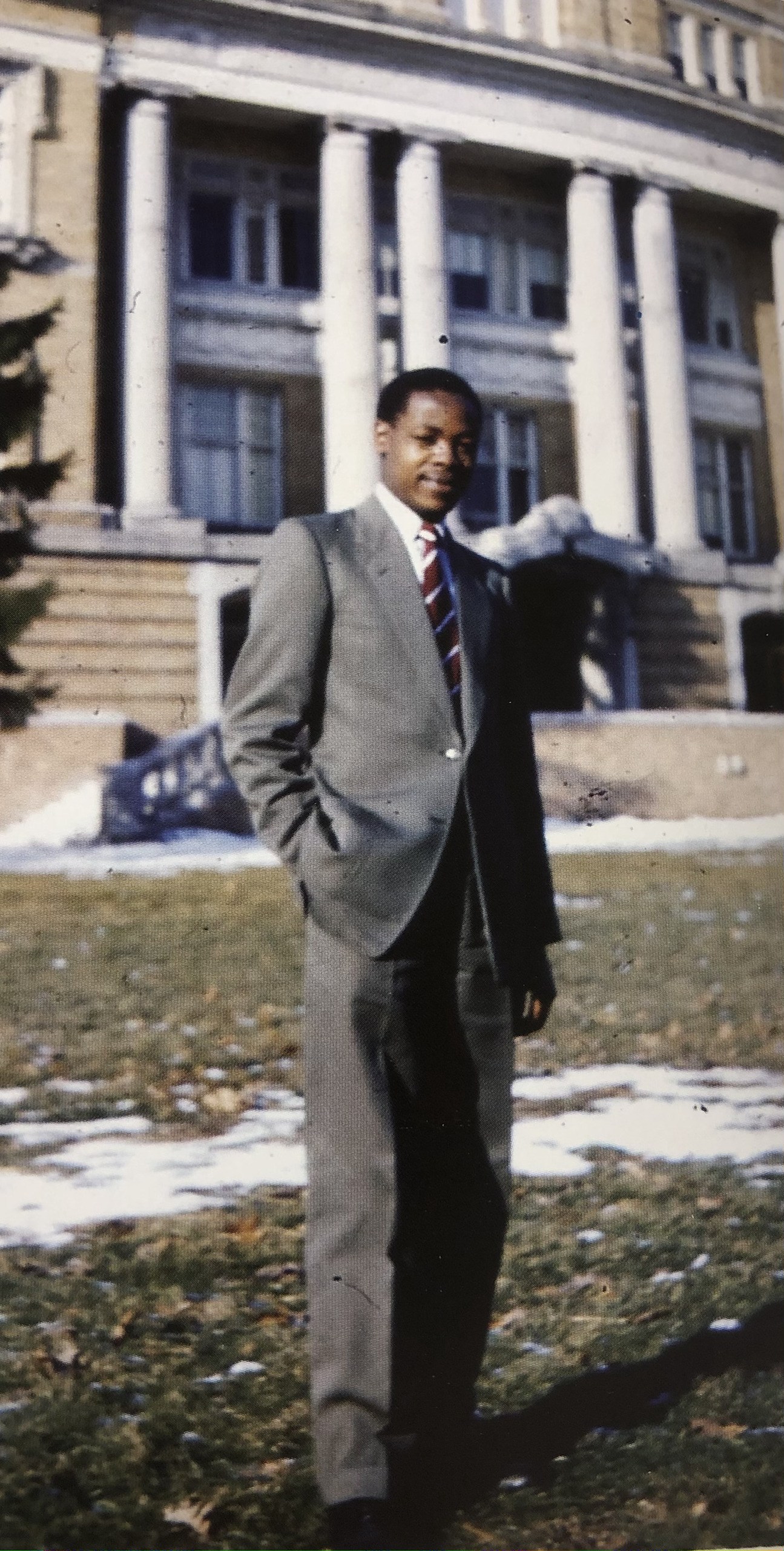 Man stands in front of University Hall 