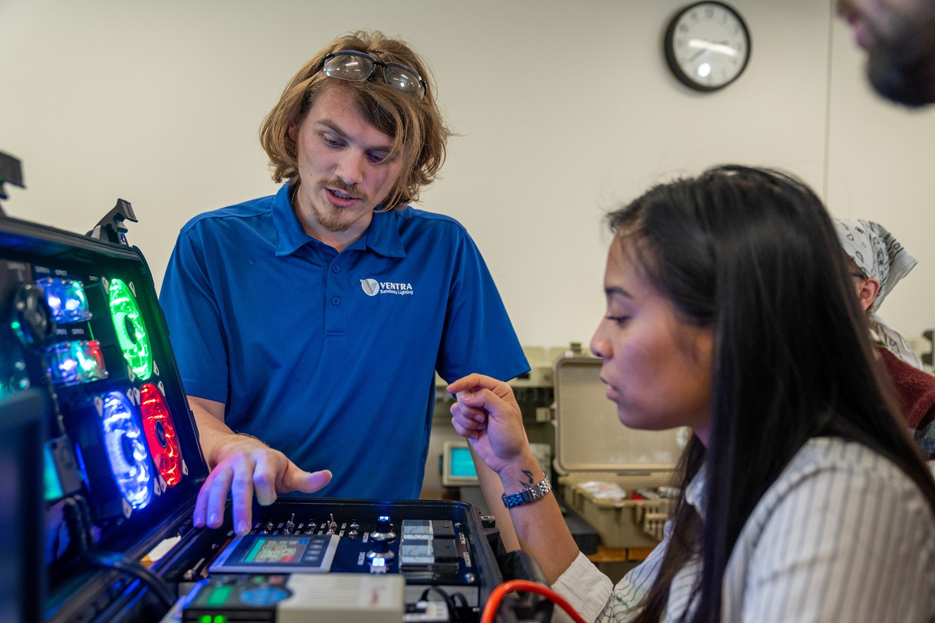 Students using equipment at workstations in the BGSU Firelands electronics lab.