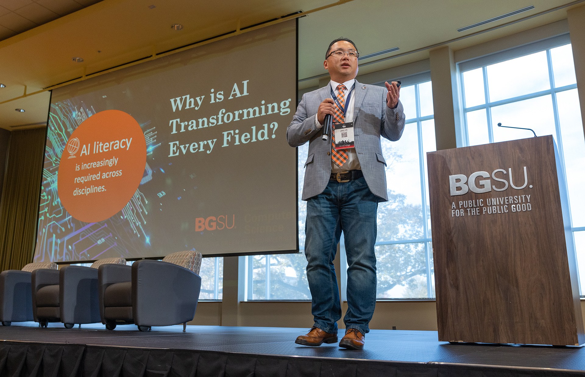 A man presents on a stage