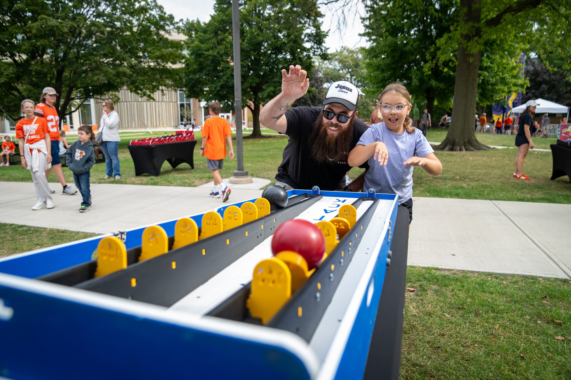 A family plays a game at Falconland