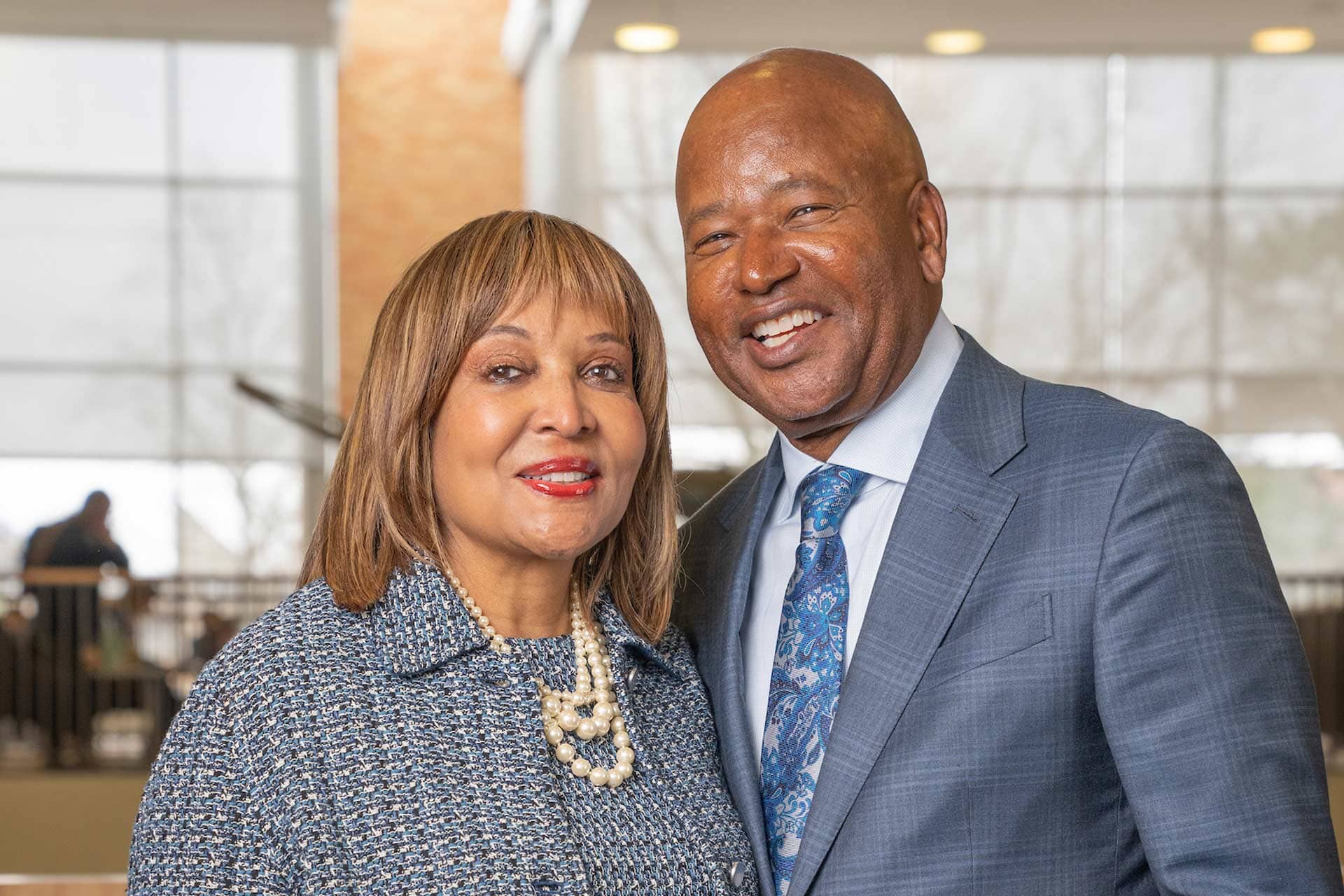 Two people pose for a photo in the BGSU student union
