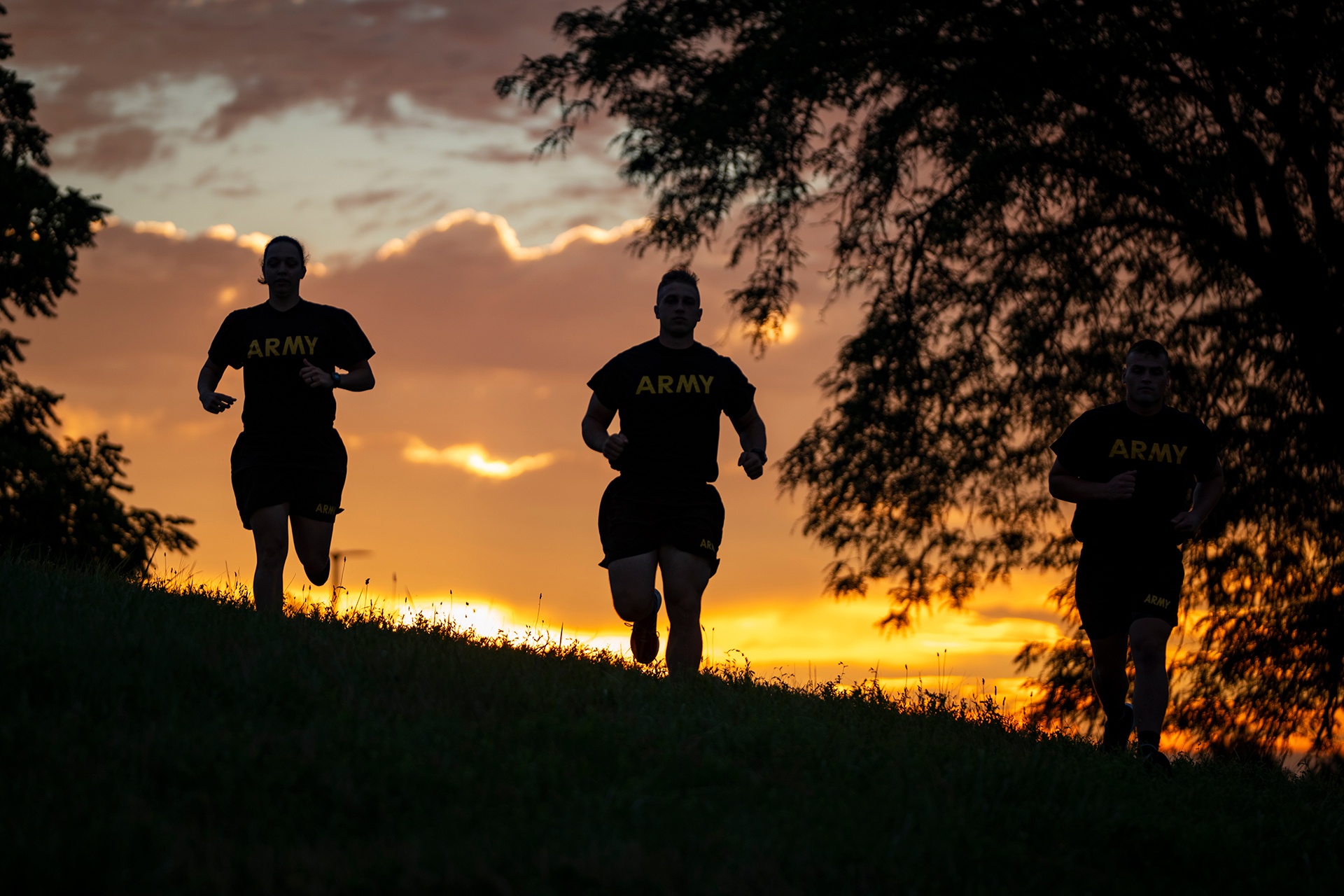 Three ROTC cadets train.