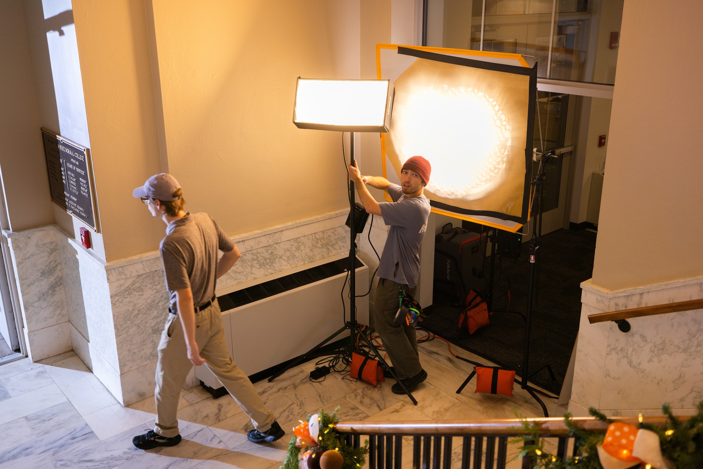 Nick working to adjust the lighting on a film set.