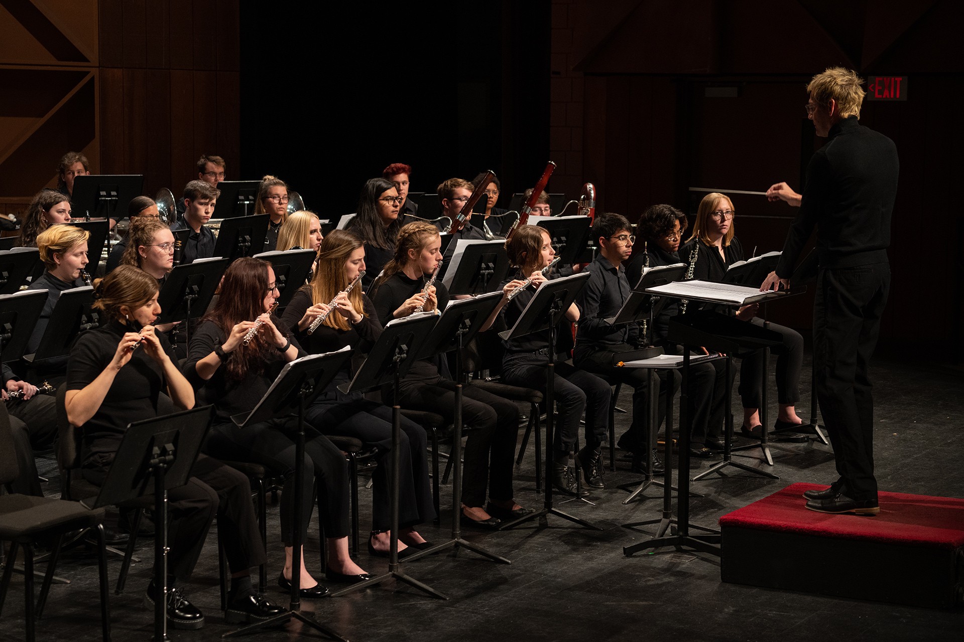 Musicians perform on stage.