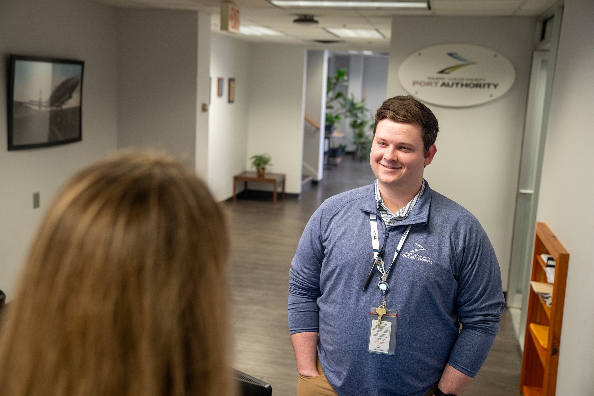 BGSU student John Michael Schmitz speaks with a colleague at the Toledo Express Airport.