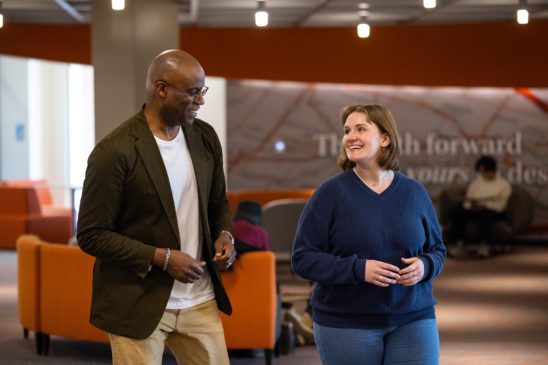 Two people talk in the BGSU Radbill Center for College and Life Design