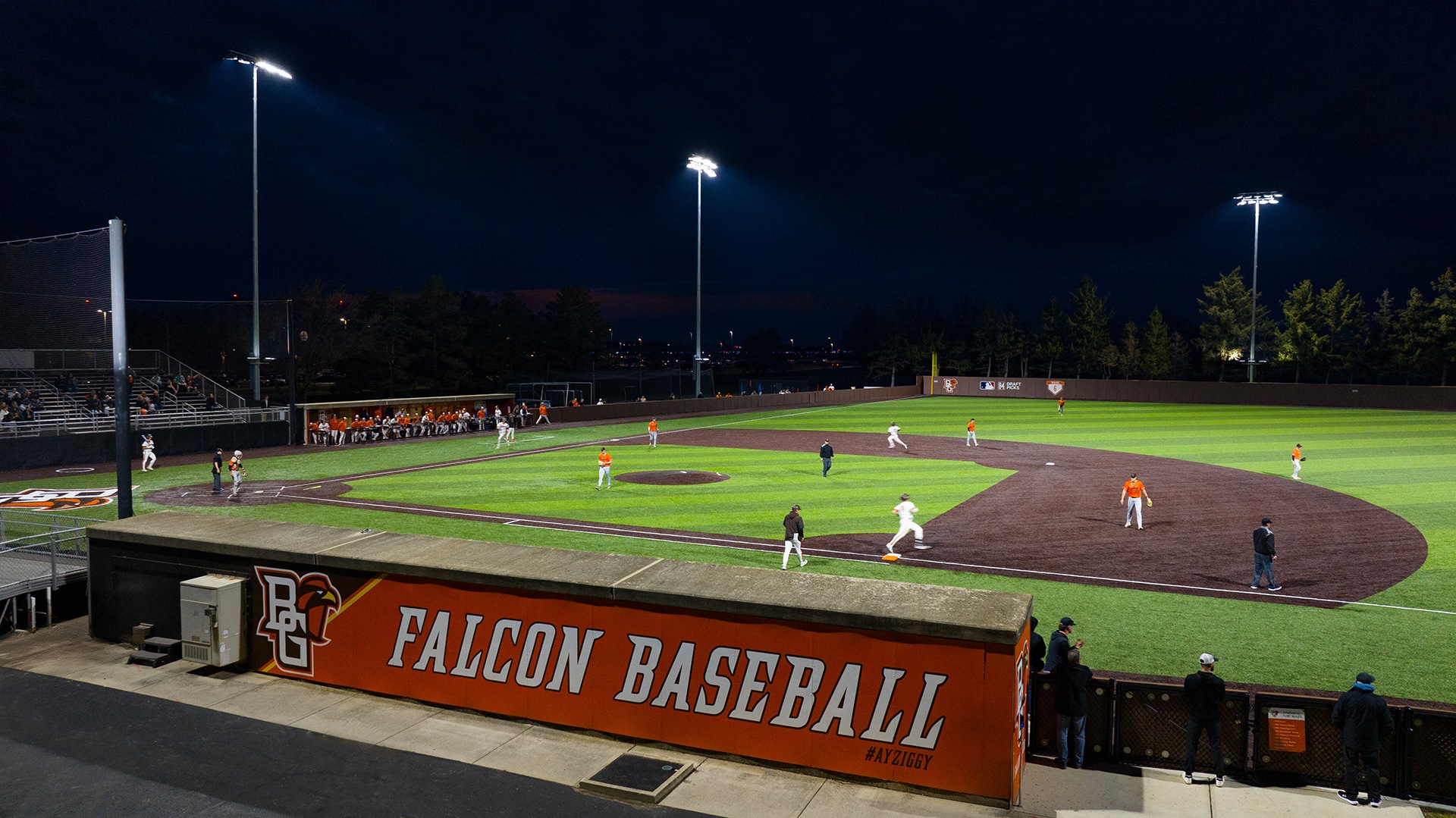 A baseball sits on a synthetic turf field
