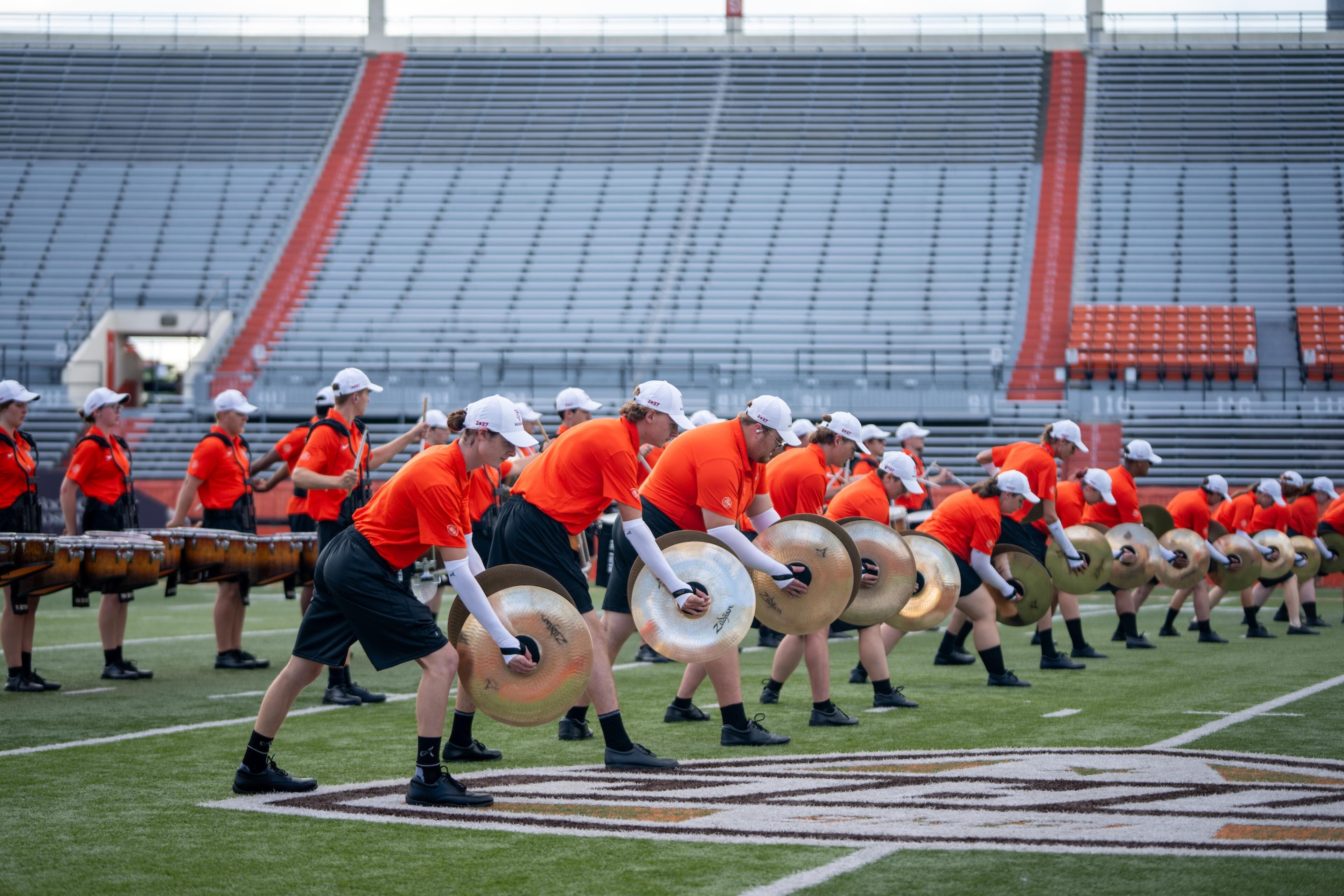 Falcon Marching Band drummers and cymbal players perform