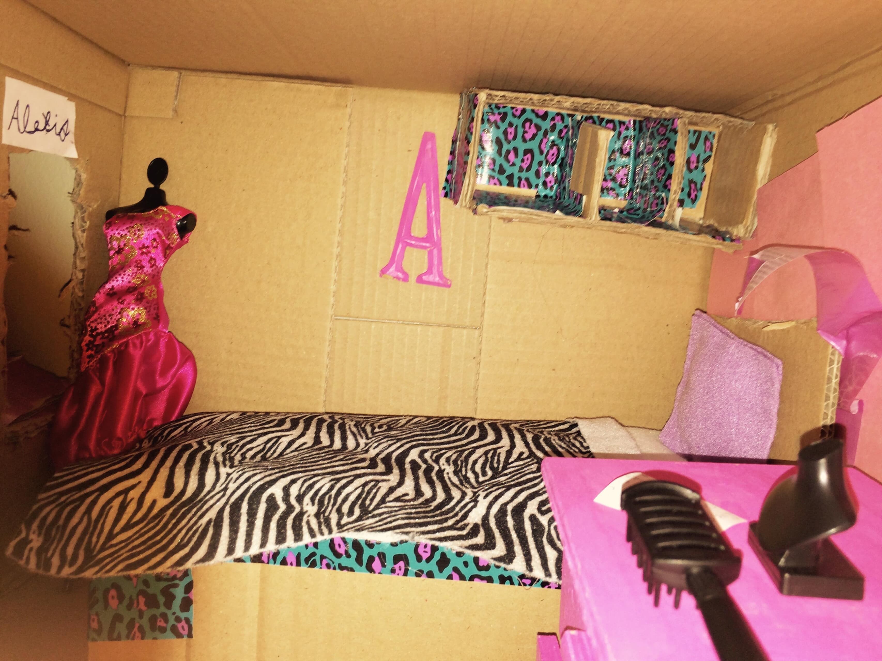 A dollhouse made from cardboard 