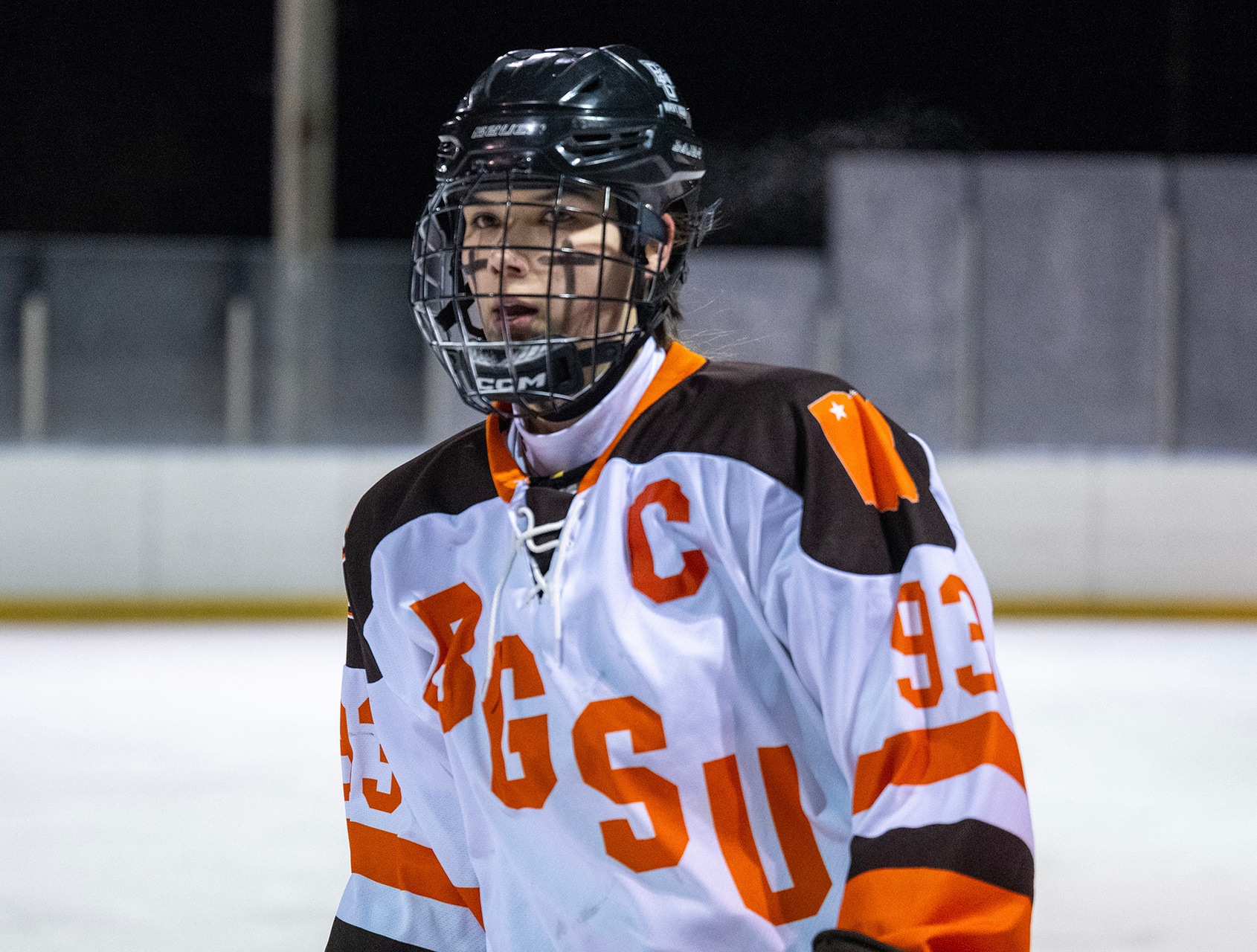 A hockey player in an outdoor game.