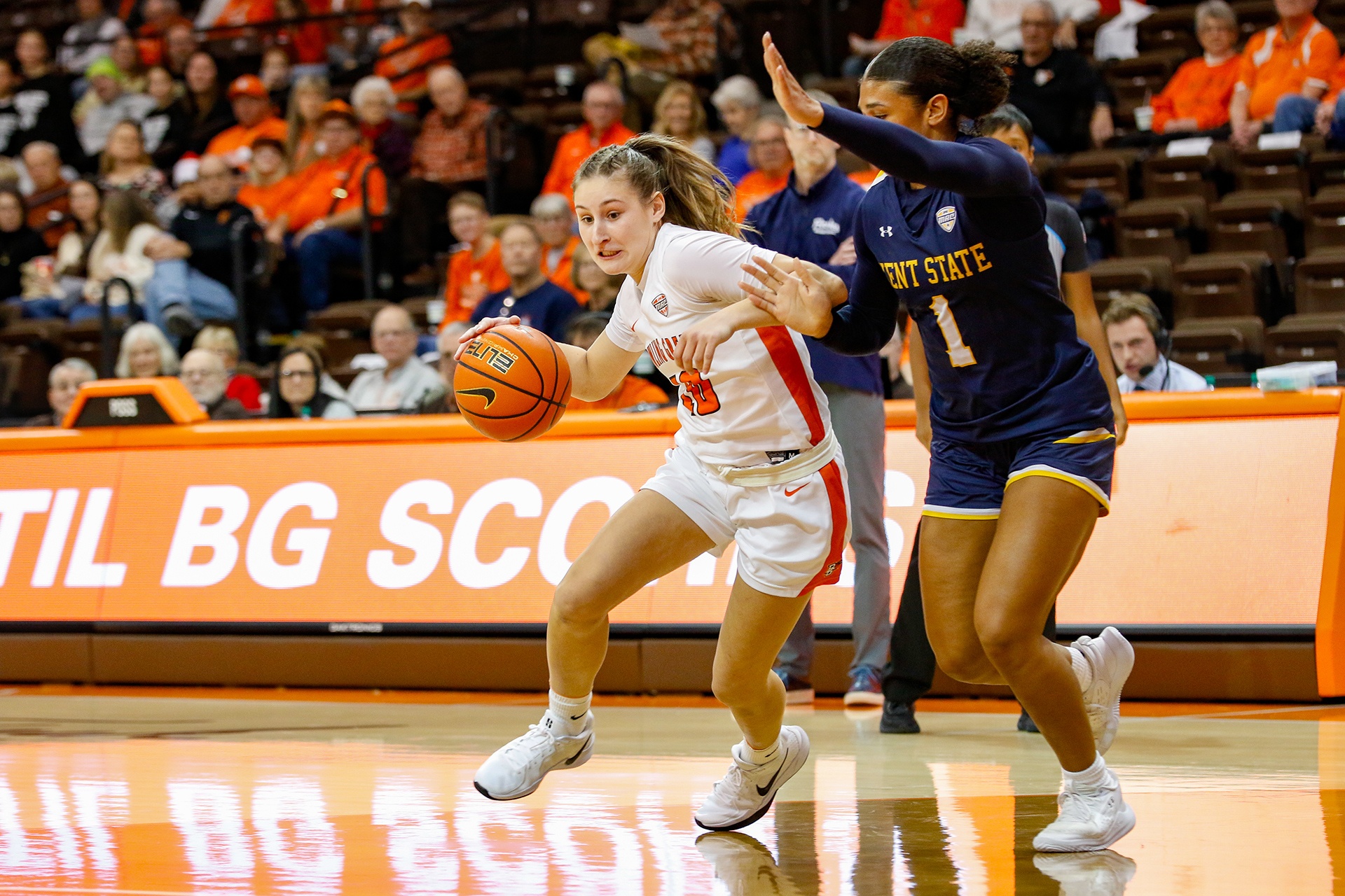 A point guard drives to the basket.