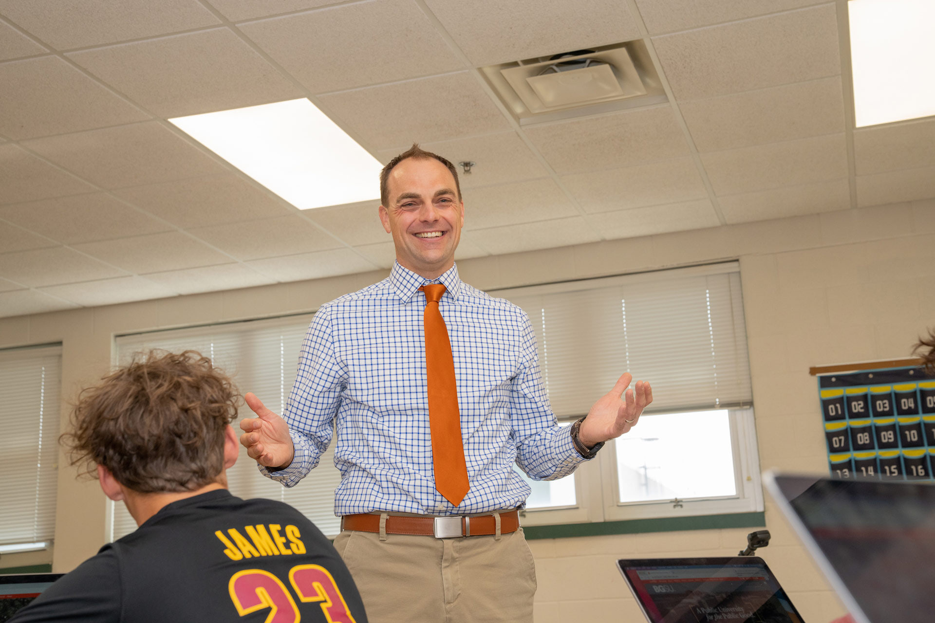 A math professor teaches in a classroom.
