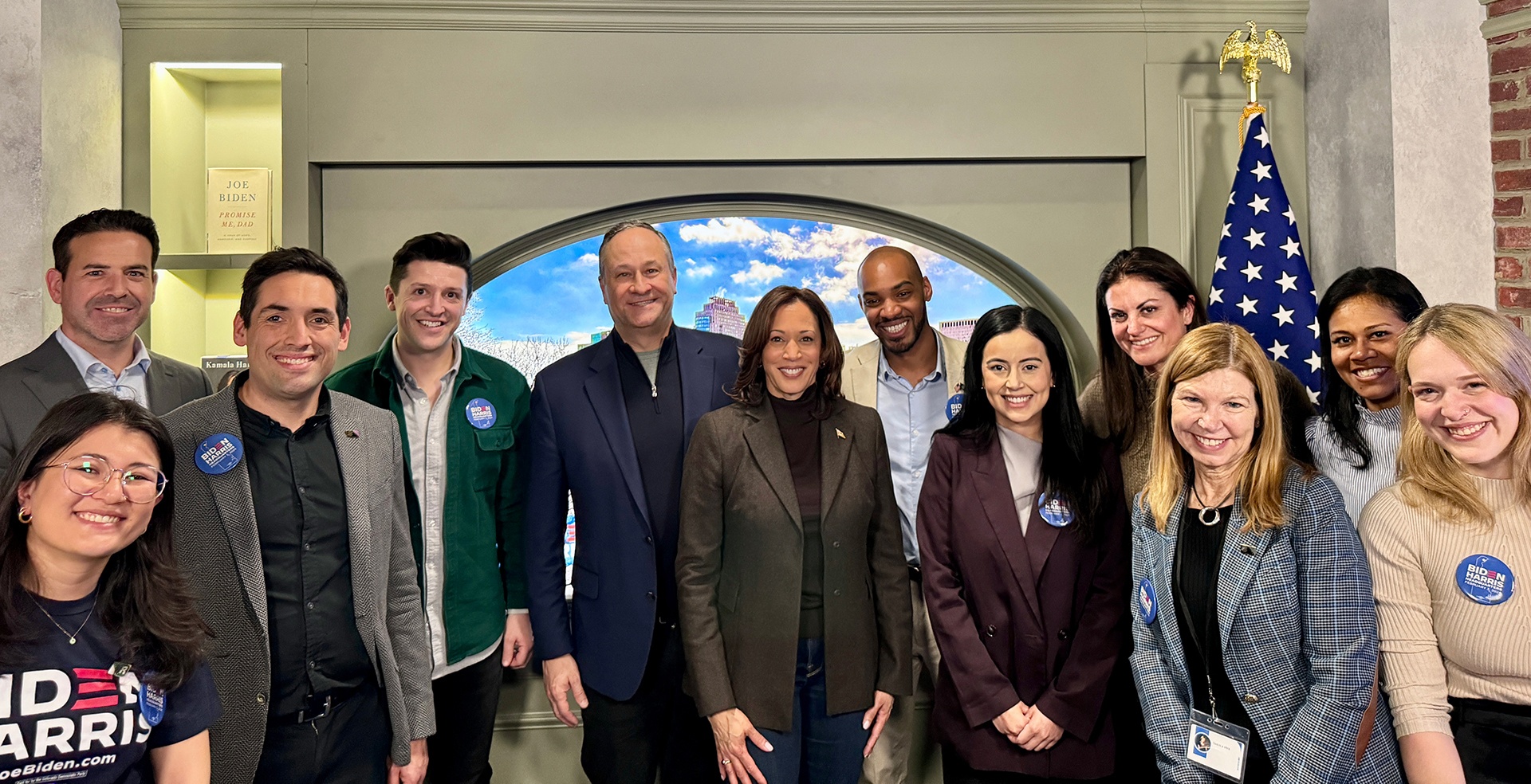 A group of picture pose for a picture with former Vice President Kamala Harris 