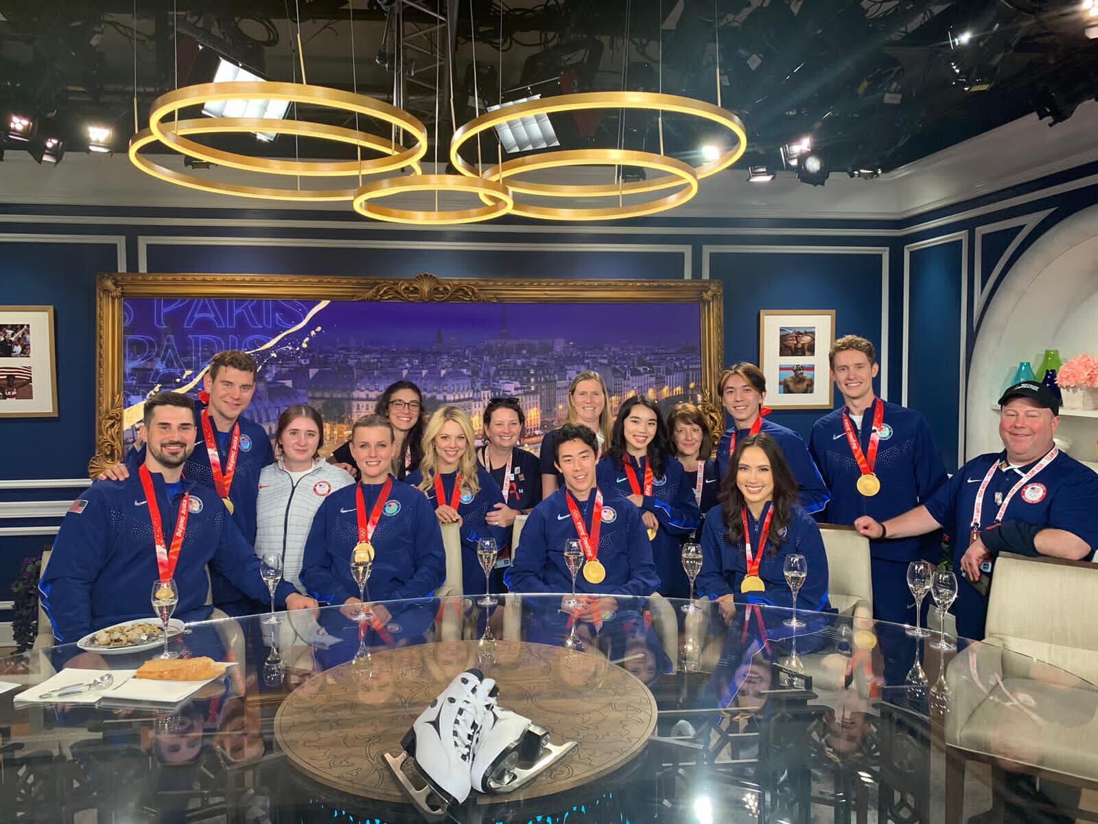 Figure skaters show their gold medals.