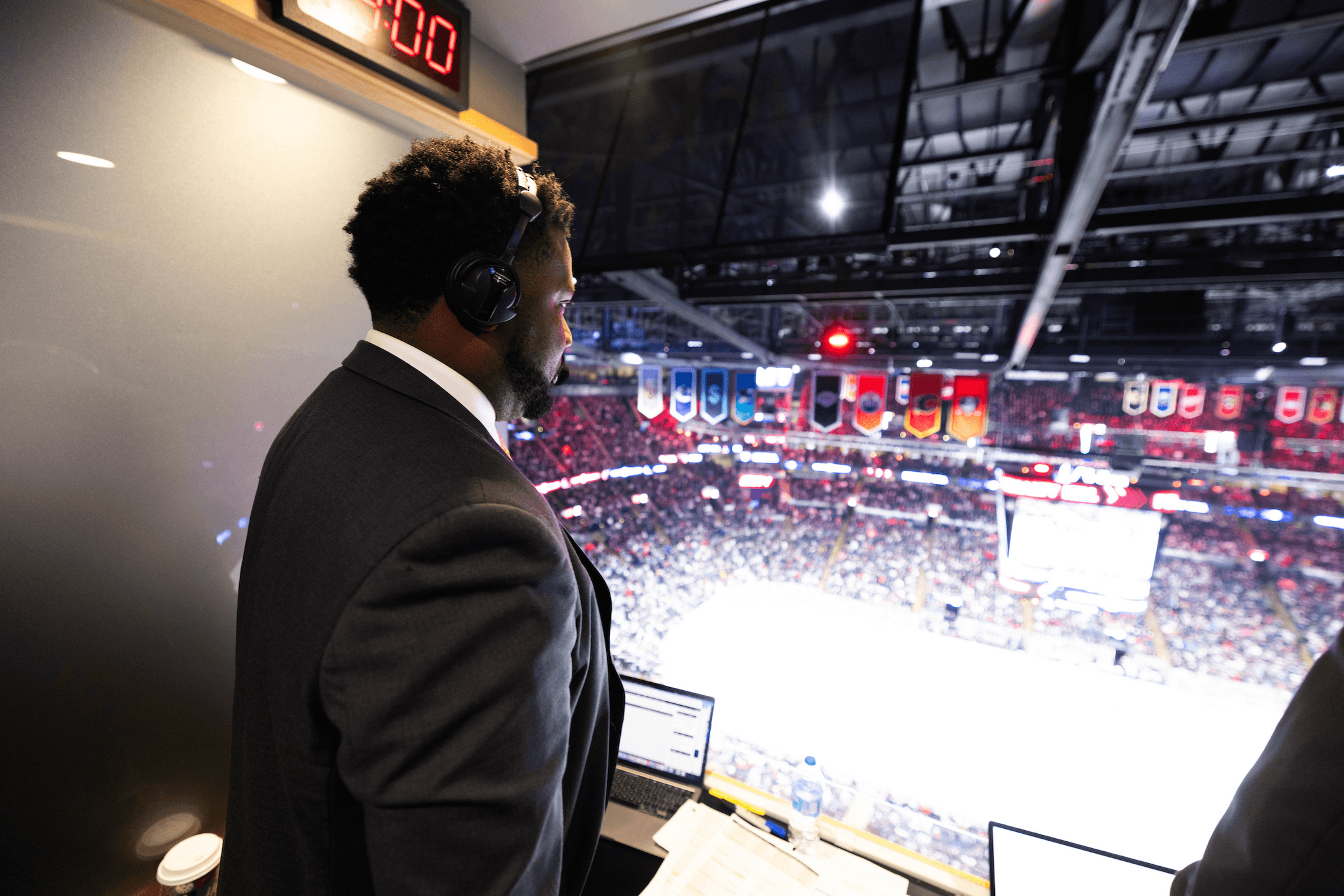 A man looks over a hockey arena.