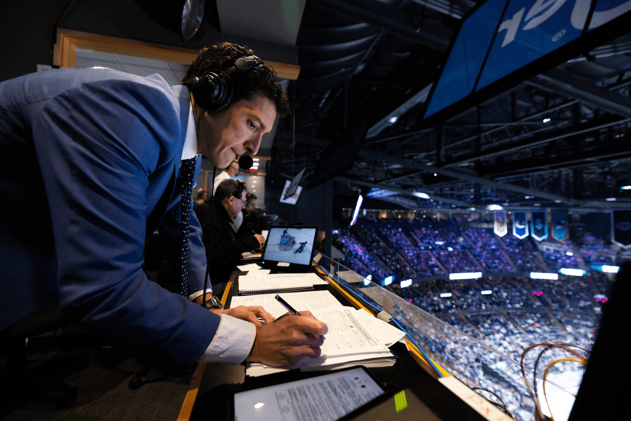 An announcer discusses the play with the color commentator.