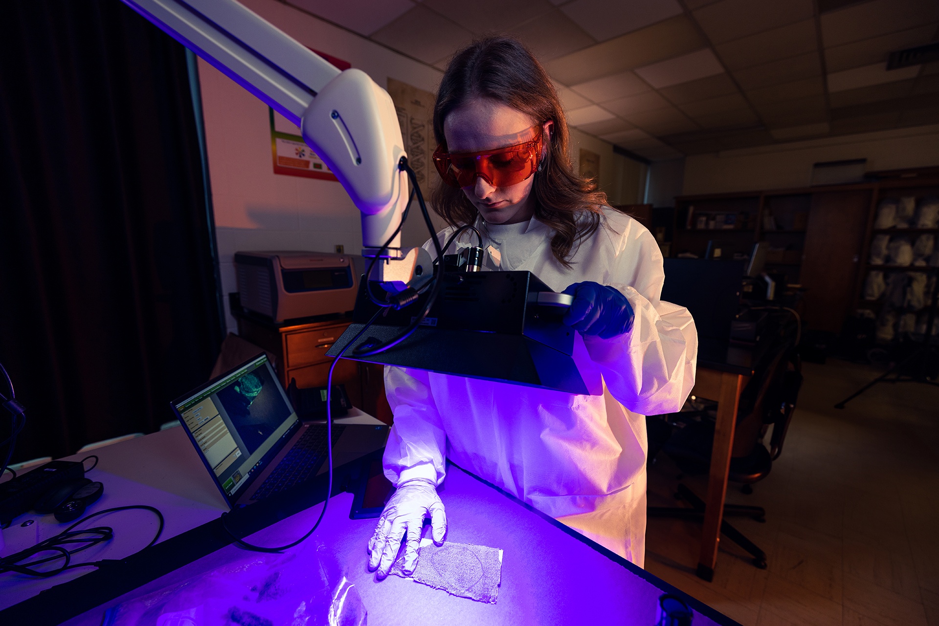 A forensic science student works in a lab at BGSU