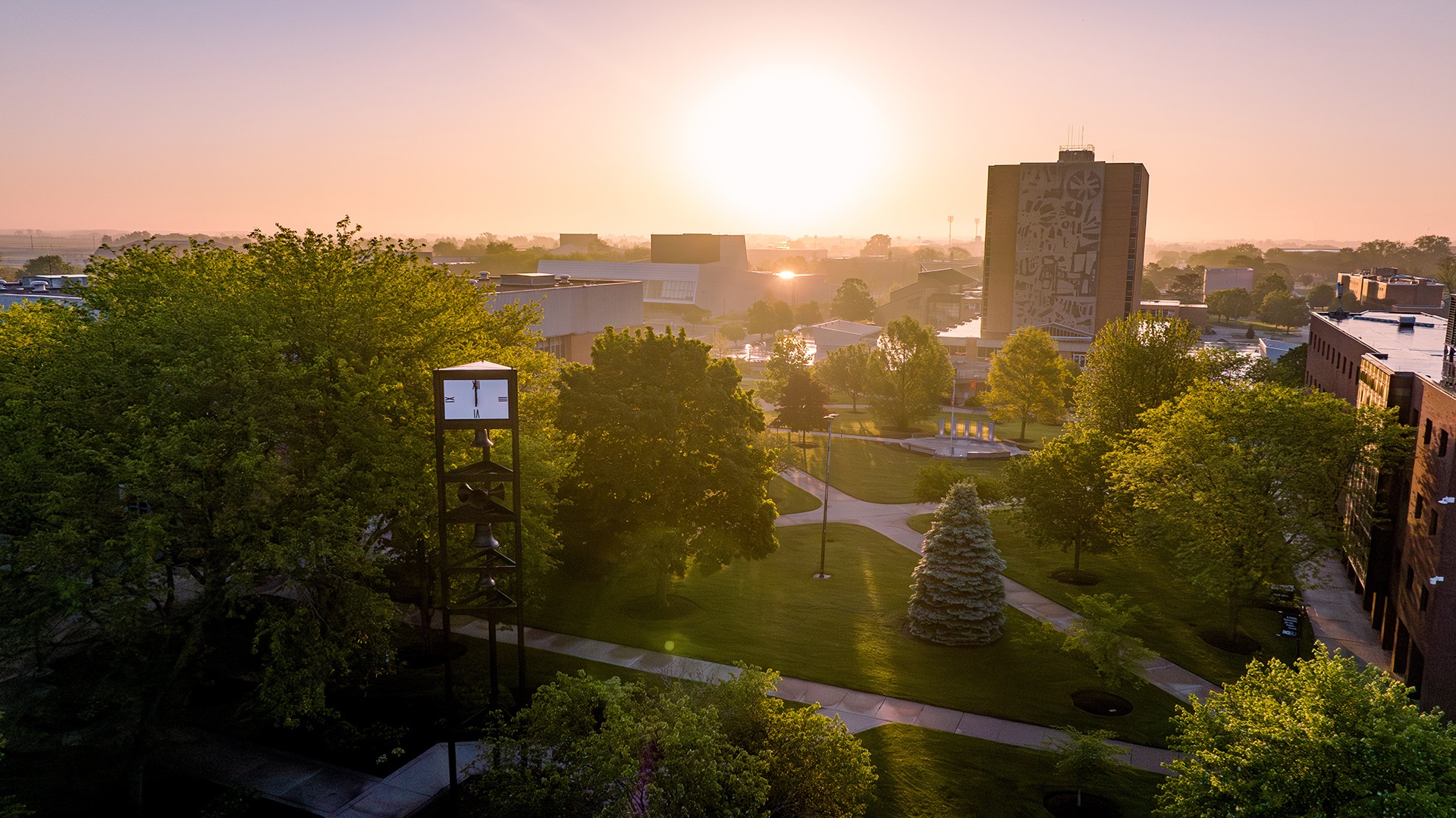 A drone shot of campus at sunrise