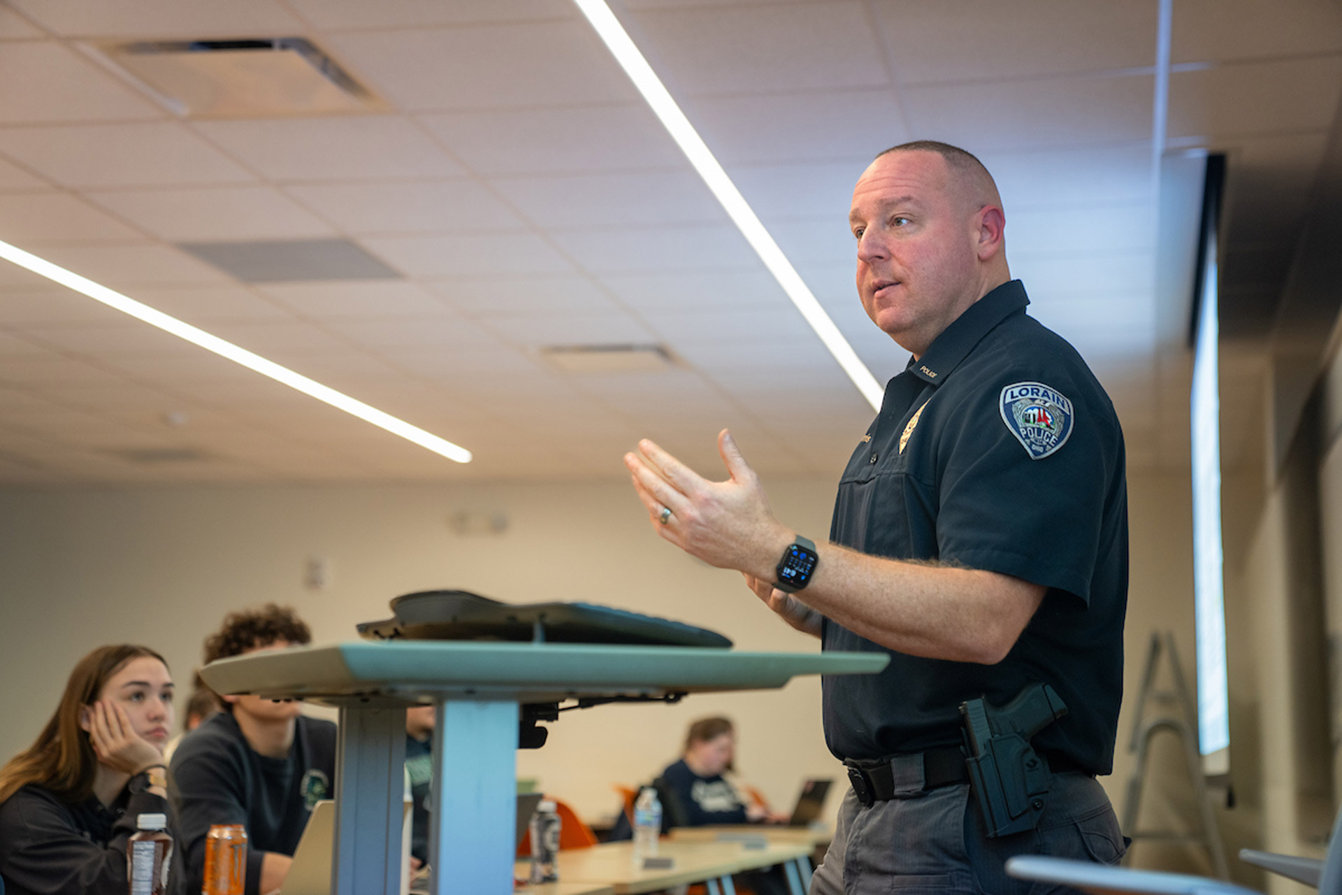 A police captain teaches a criminal justice course at BGSU