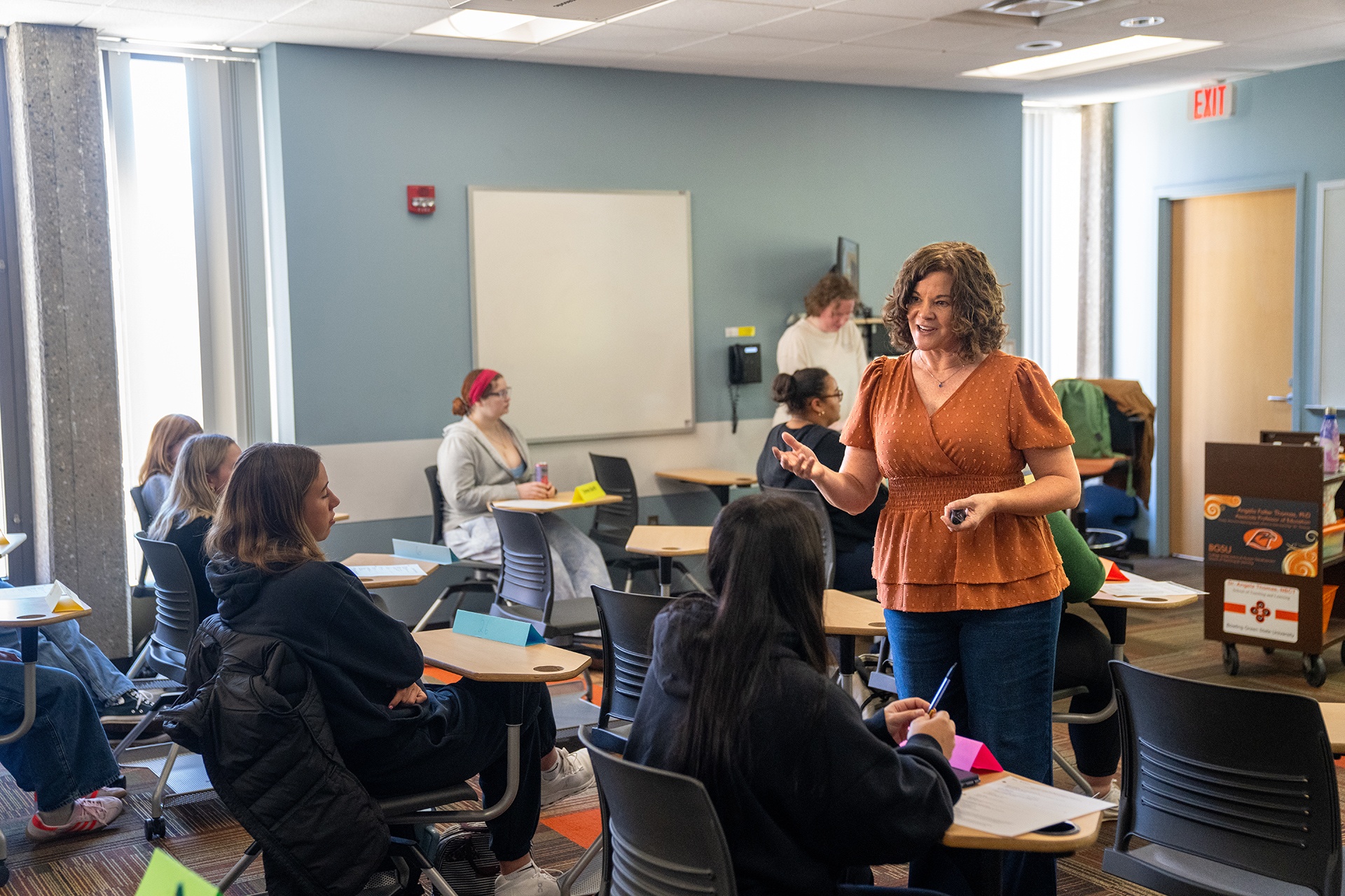 A teacher instructs a class.