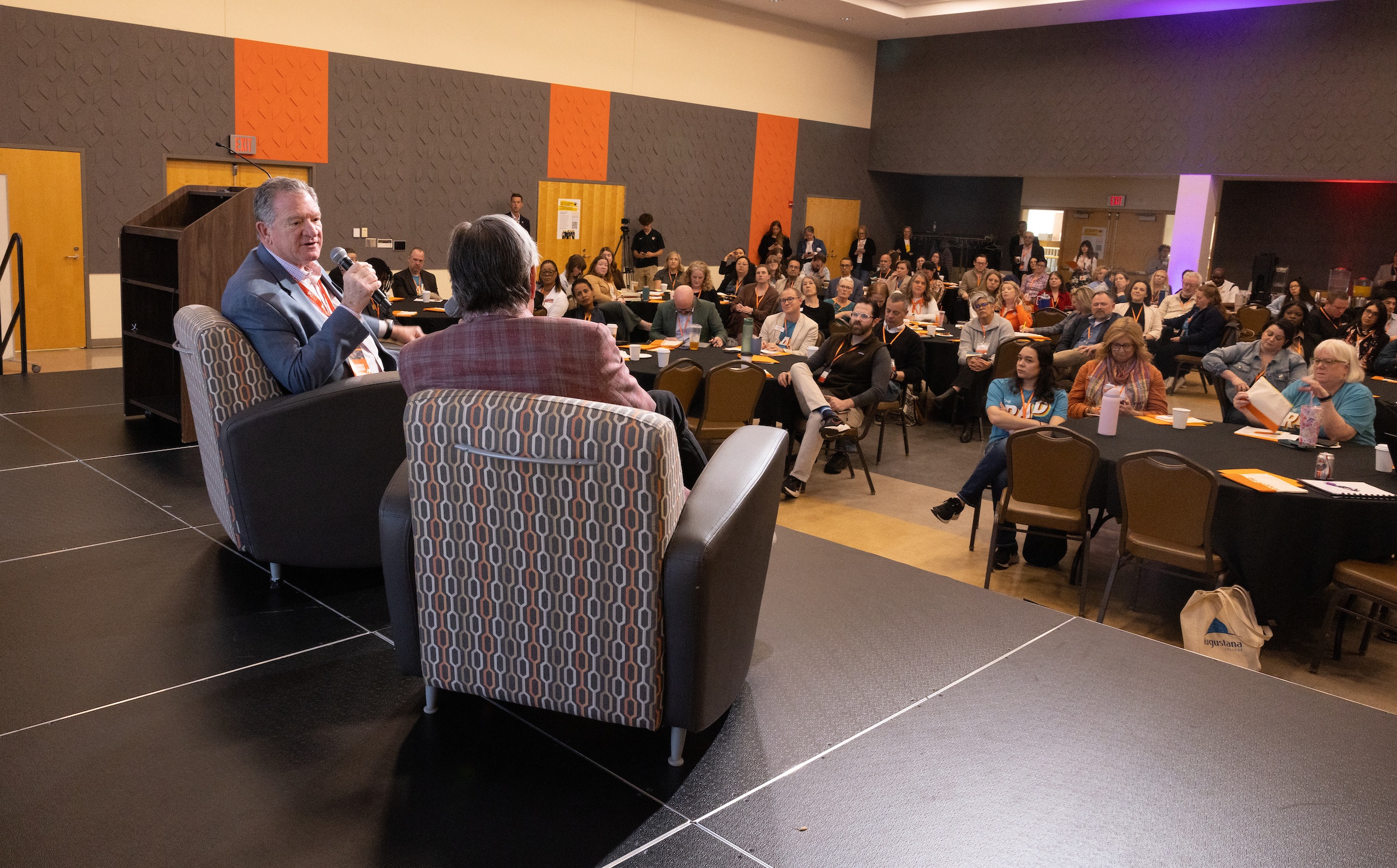 BGSU President Rodney K. Rogers and Bill Burnett speak to a crowd of people
