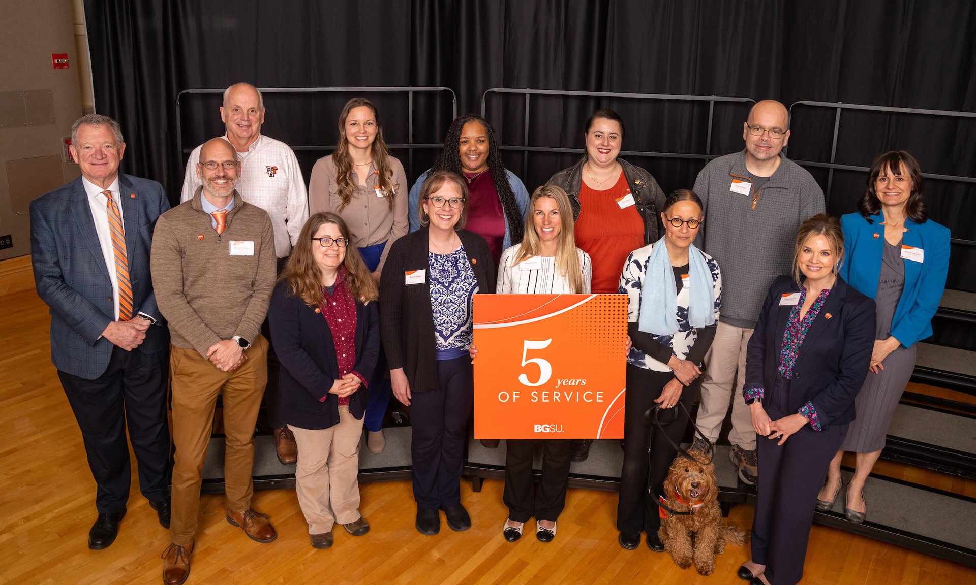 BGSU employees hold a sign with text that reads: 5 years of service 