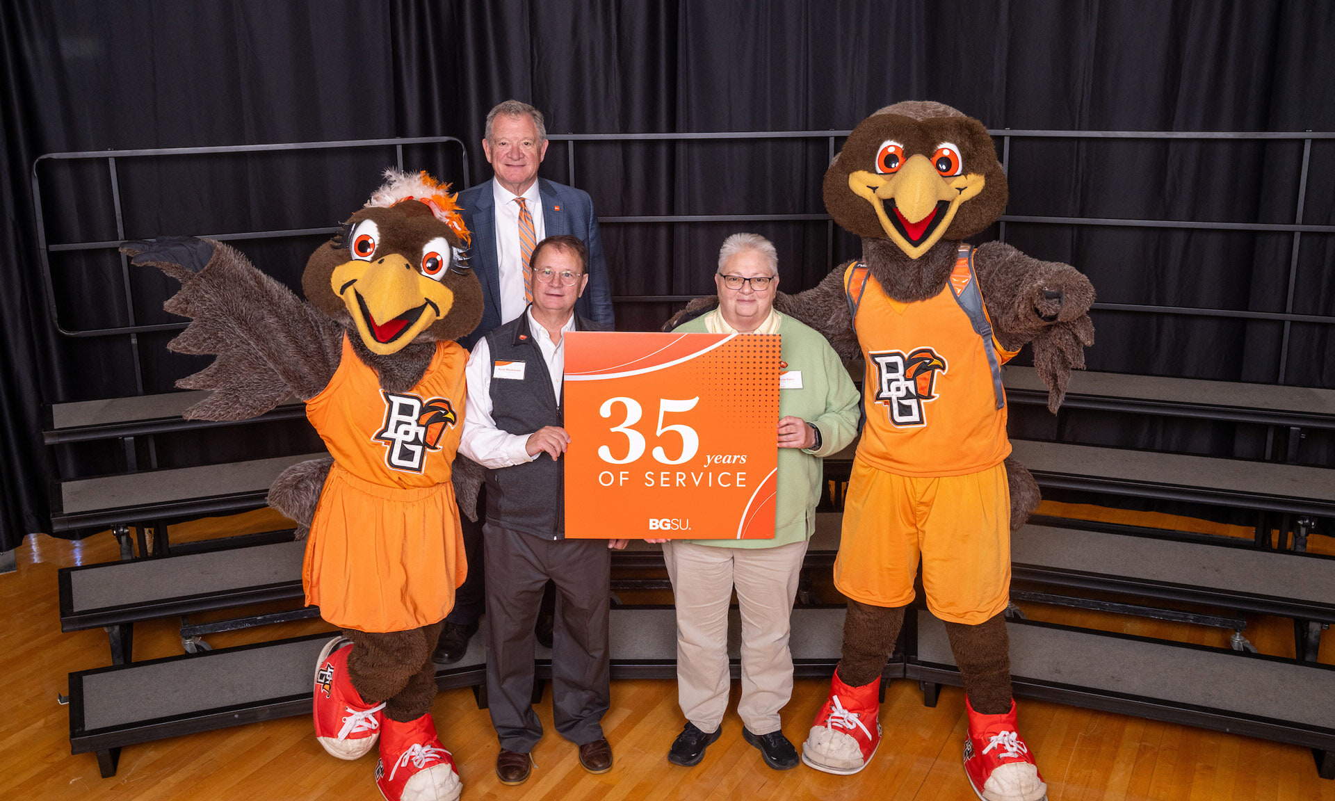 BGSU employees hold a sign with text that reads: 35 years of service