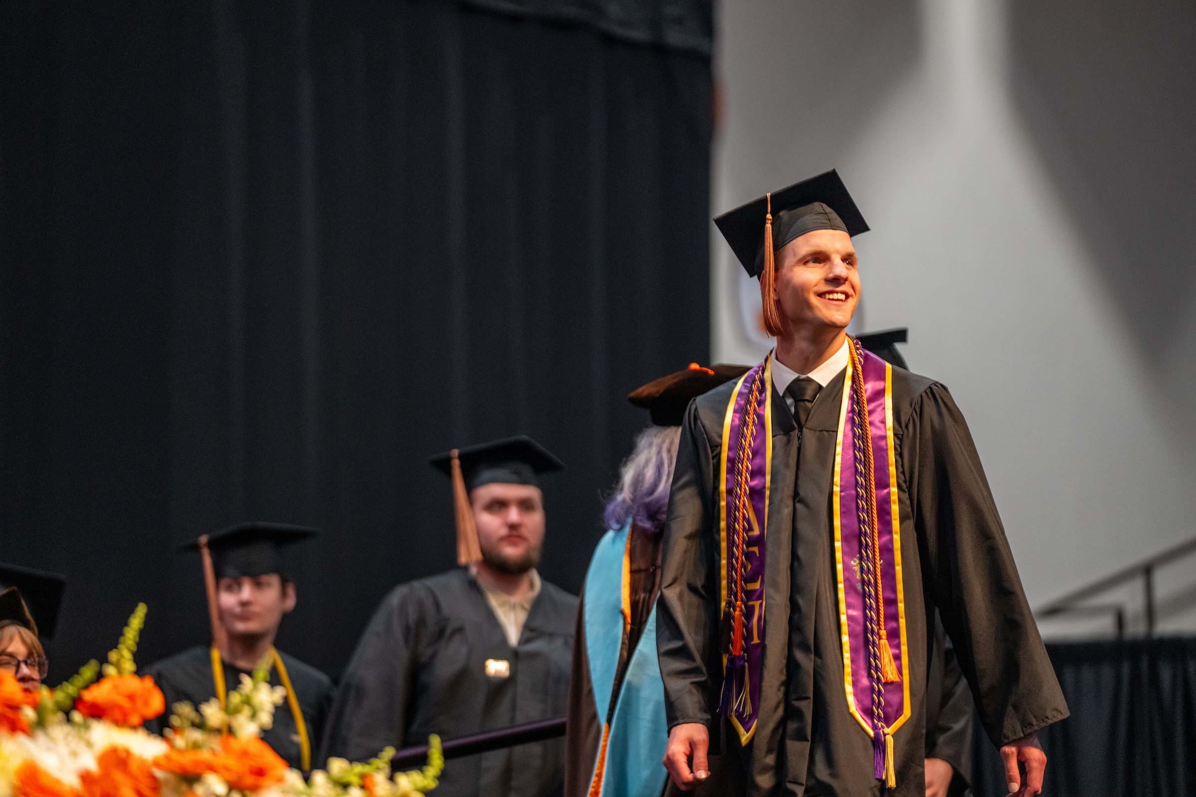 A person looks forward during commencement