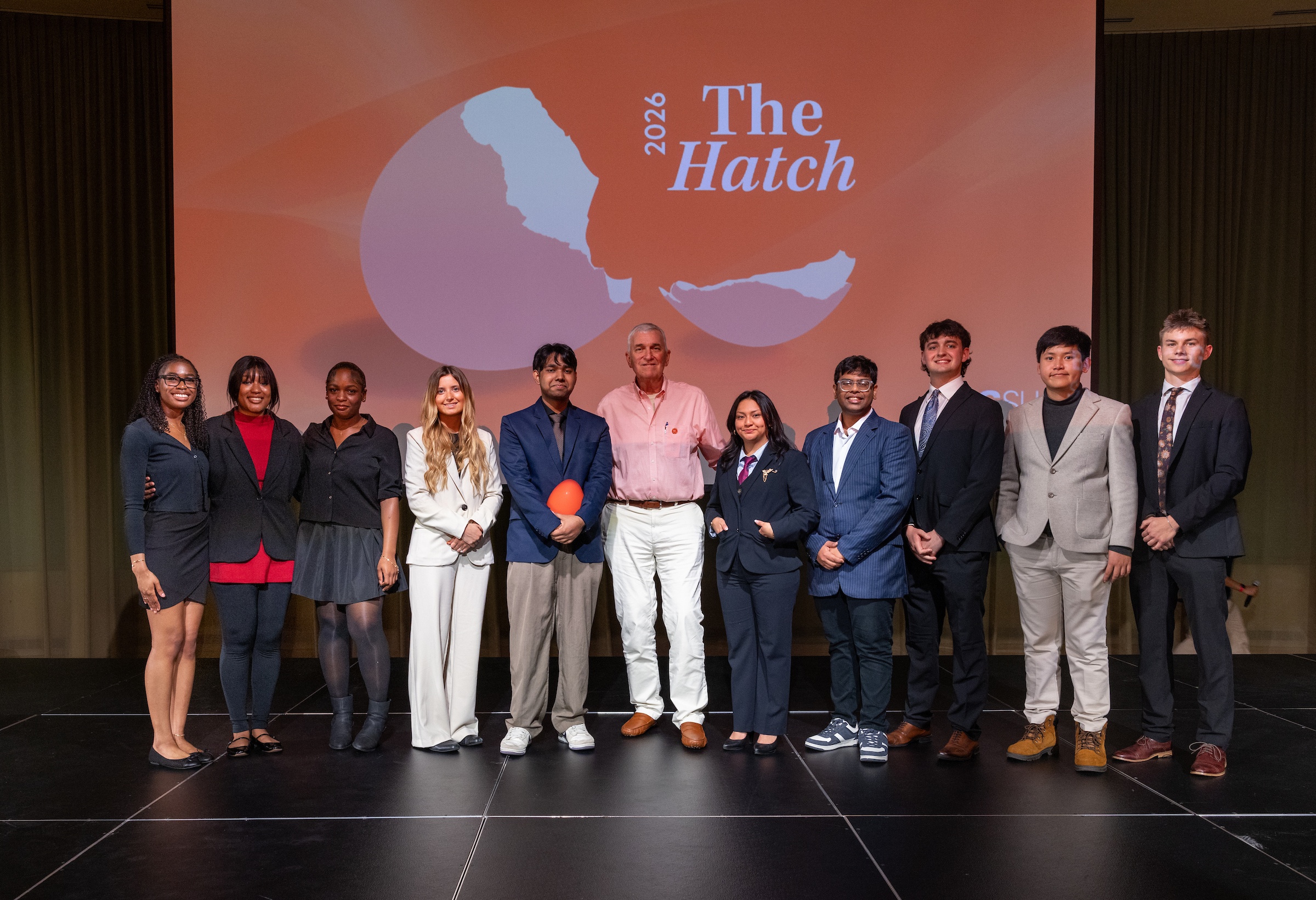 A group of people pose for a picture after the BGSU Hatch event.