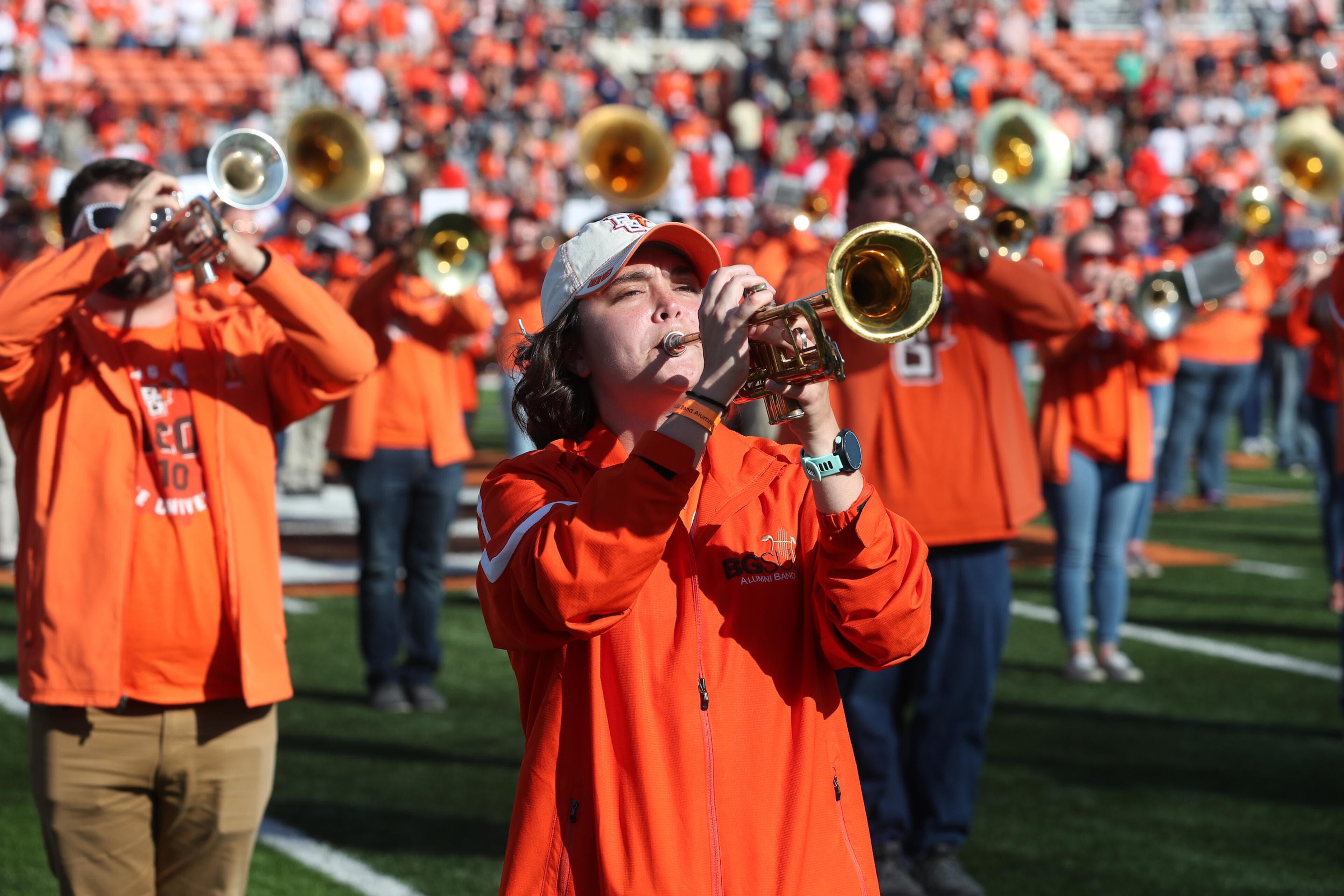 Alumni band members performing during Homecoming