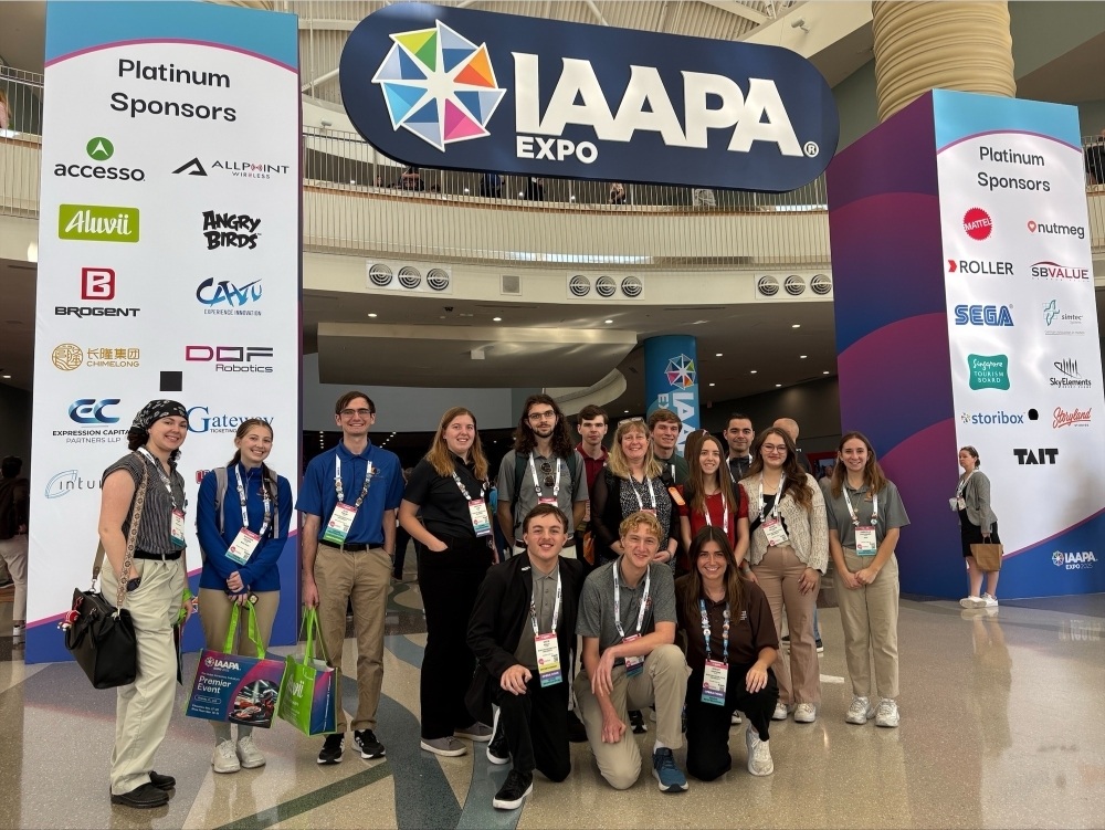 Students pose for a picture at the IAAPA Expo.