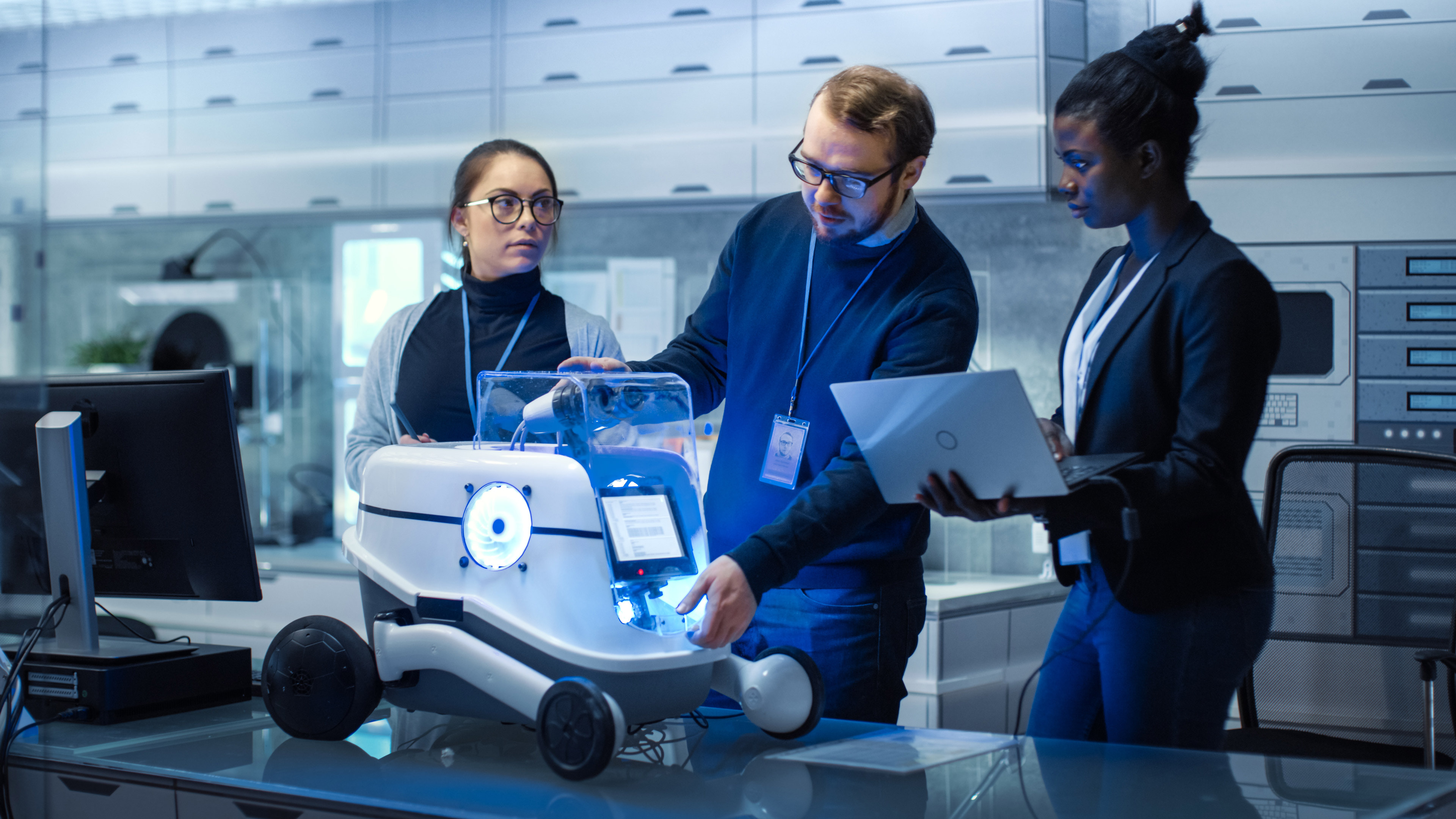 Multi Ethnic Team of Male and Female Leading Scientists Work on Innovative Robotics Technology. They Work in a Modern Laboratory/ Research Center.