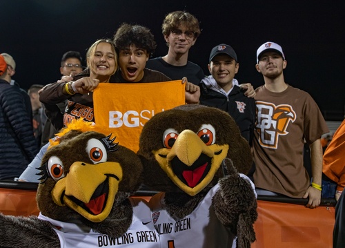 Four students wit mascots