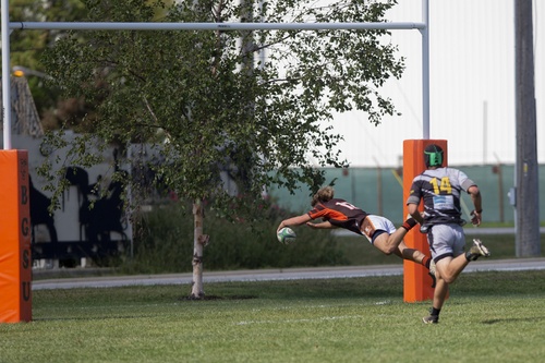 BGSU Rugby player dives into the end zone