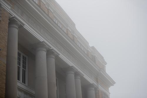 Close up of University Hall façade in early morning fog