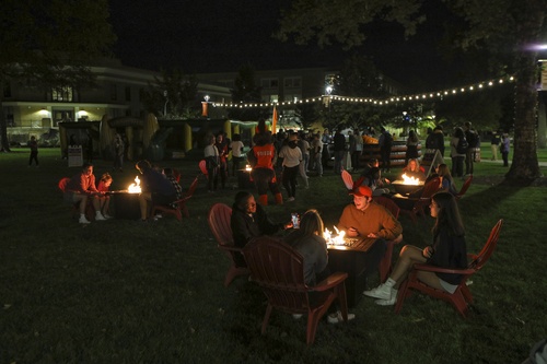 Students gather in the evening during Fall Fest