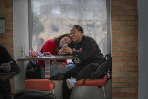 Two students laughing together at the Bowen-Thompson Student Union 