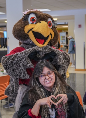 Frieda poses with student at the union