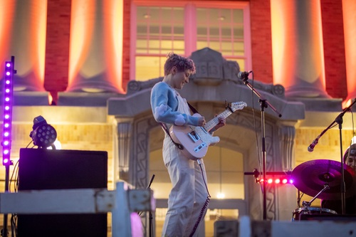 Student plays guitar during Bloom Fest