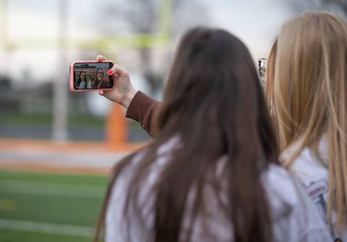 Two students take selfie on campus