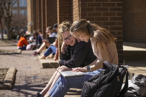 Students enjoy warm spring day outside Central Hall