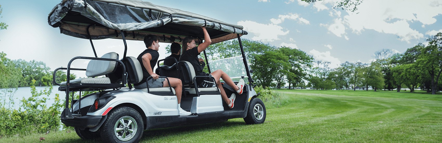 students in golf cart
