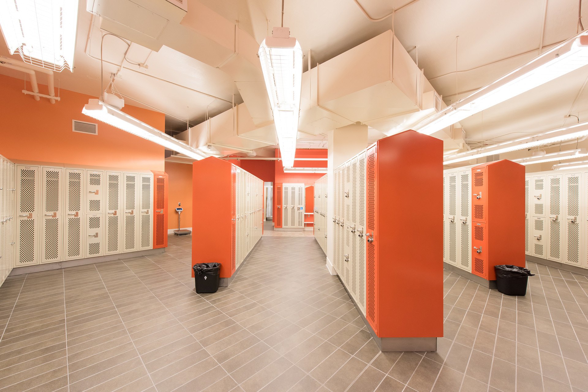 Locker room area with showers and lockers