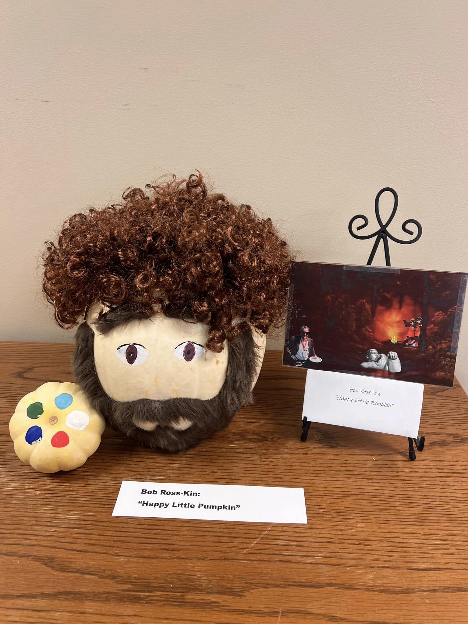 A pumpkin painted and decorated as artist, Bob Ross. 