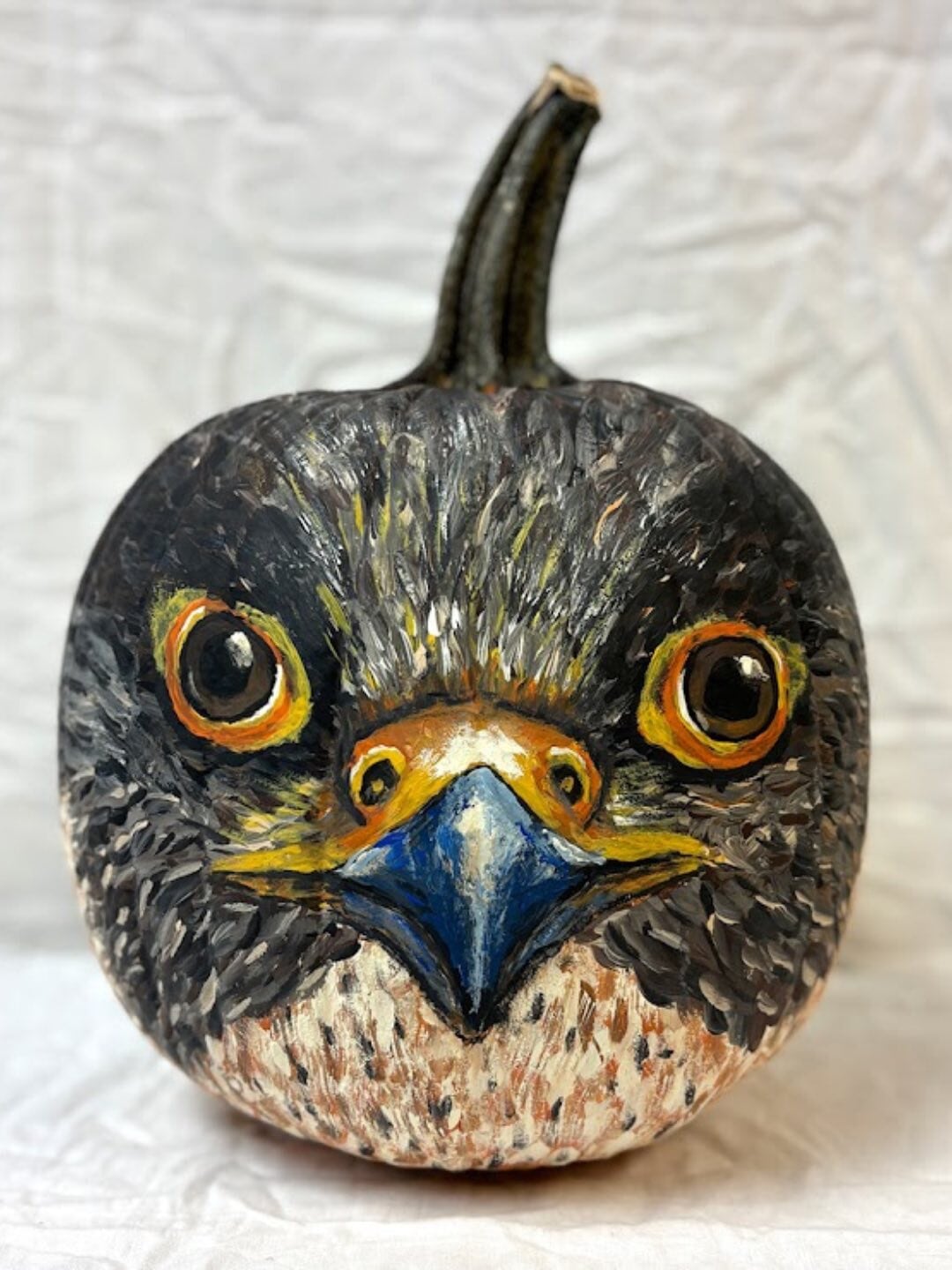 A pumpkin painted as a bird