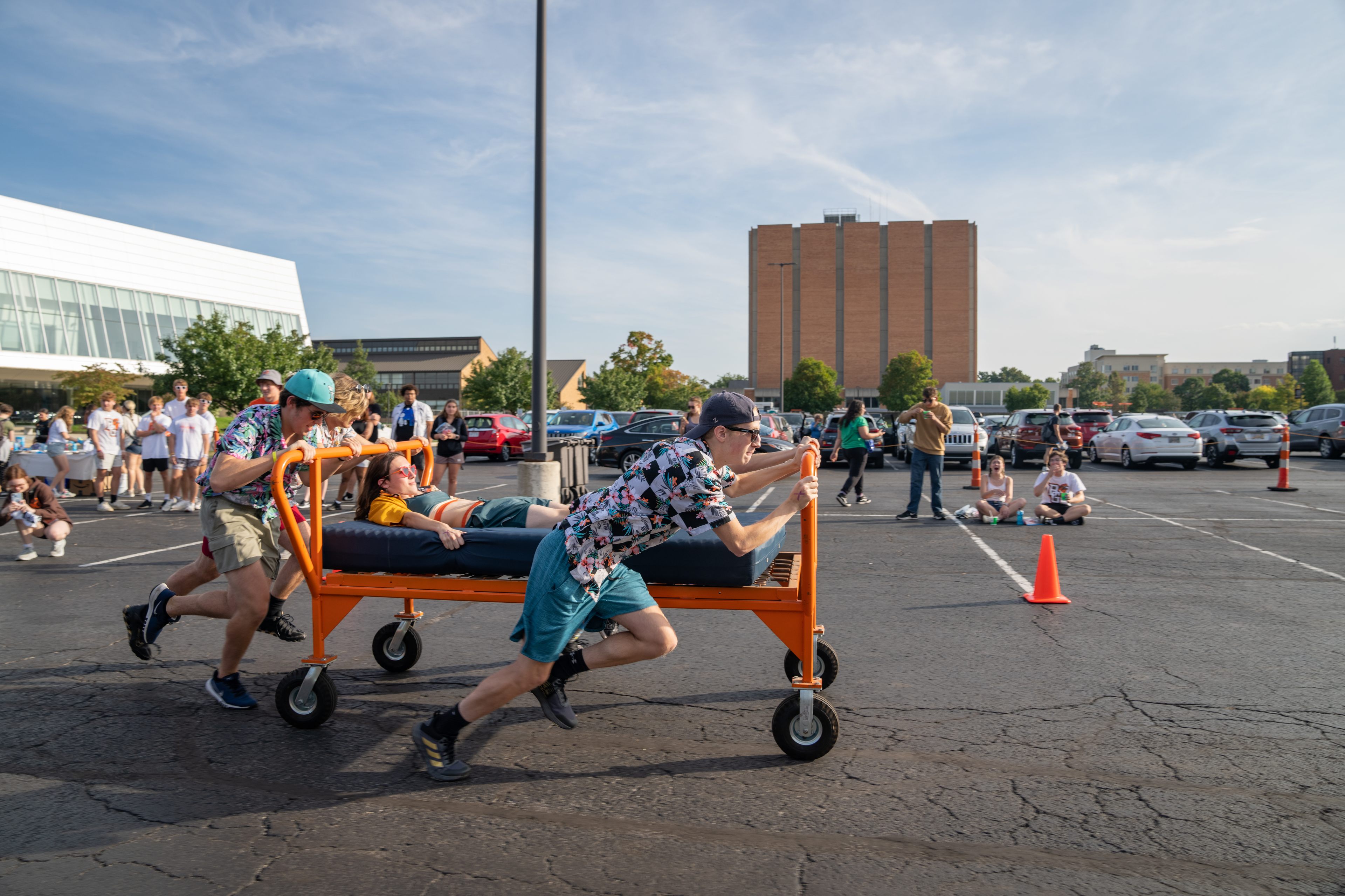 BGSU Students rolling on cart on campus