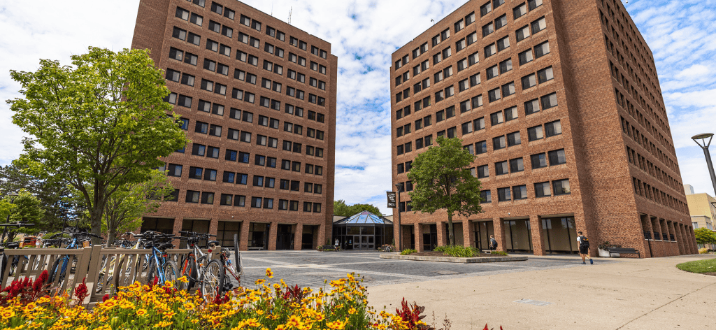 BGSU Students rolling on cart on campus