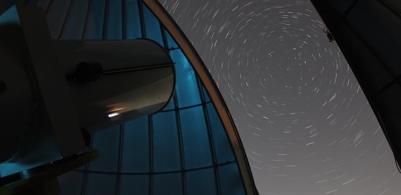 Stars circle the north celestial pole, viewed looking out from inside the dome of BGSU’s 20-inch telescope