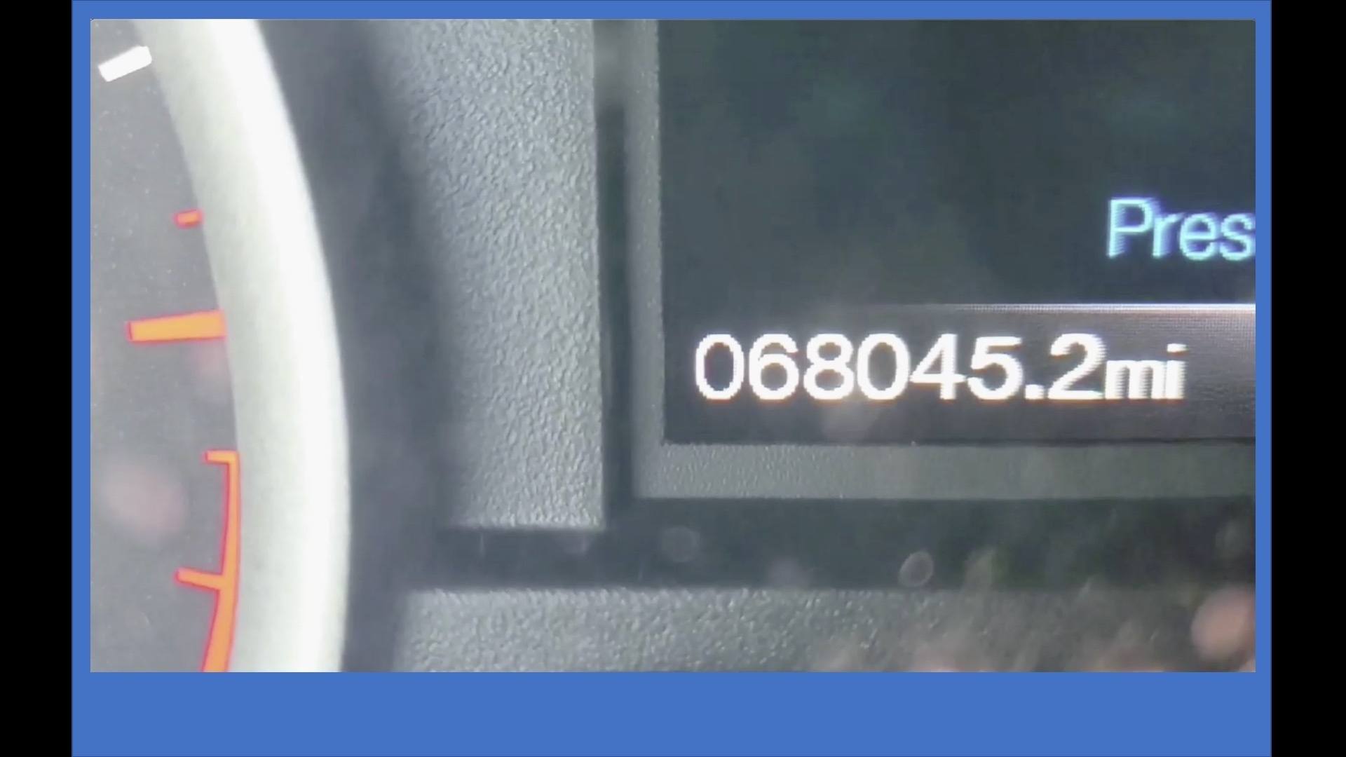 Close-up photo of numbers on digital speedometer inside car